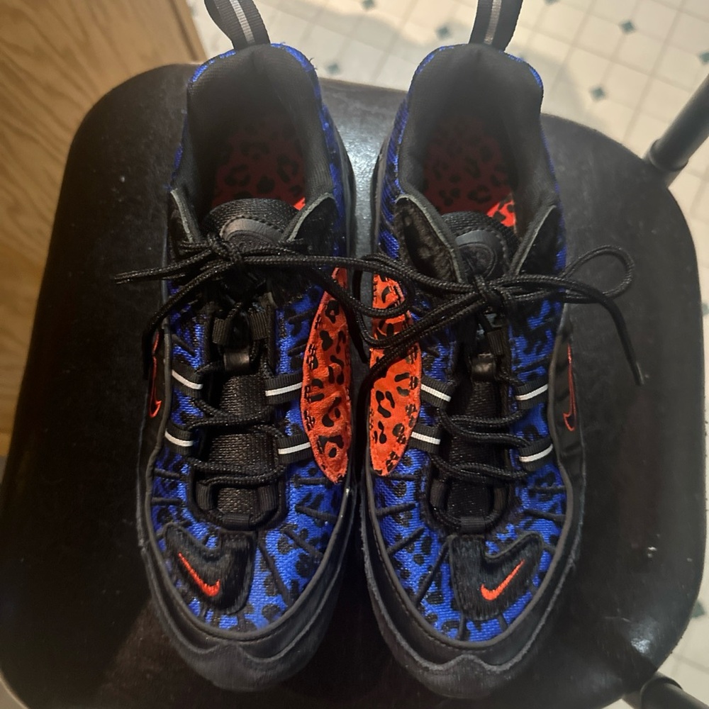 Nike Blue and Black Sneakers with Orange Accents